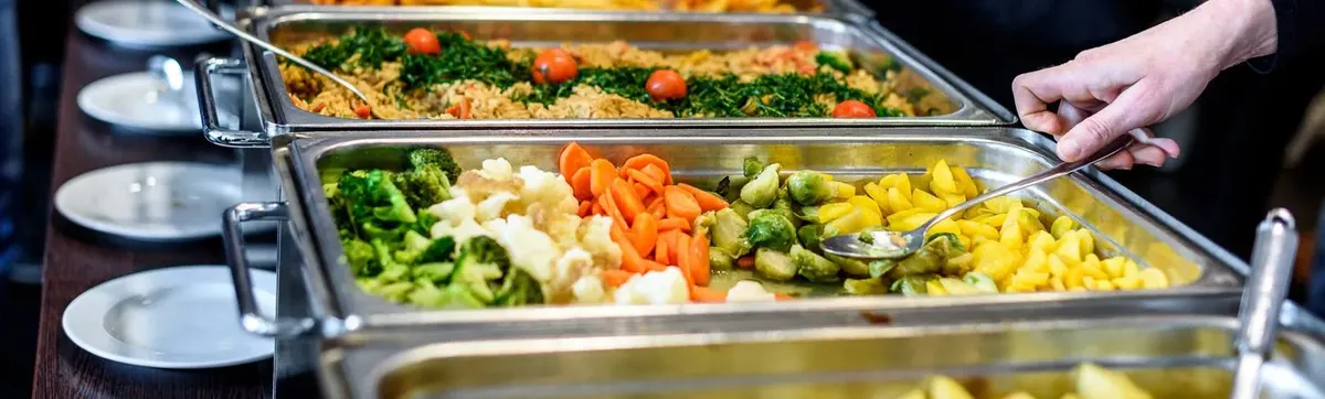 Catering trays of vegetables and rice