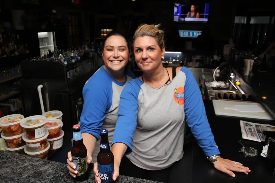 Guests and food at 1048 Bar & Grill