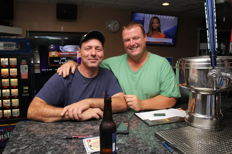 Guests and food at 1048 Bar & Grill