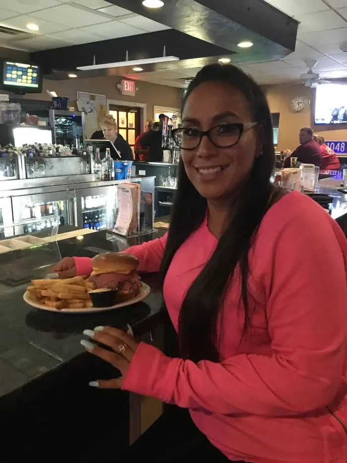 Guests and food at 1048 Bar & Grill