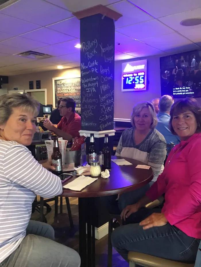 Guests and food at 1048 Bar & Grill