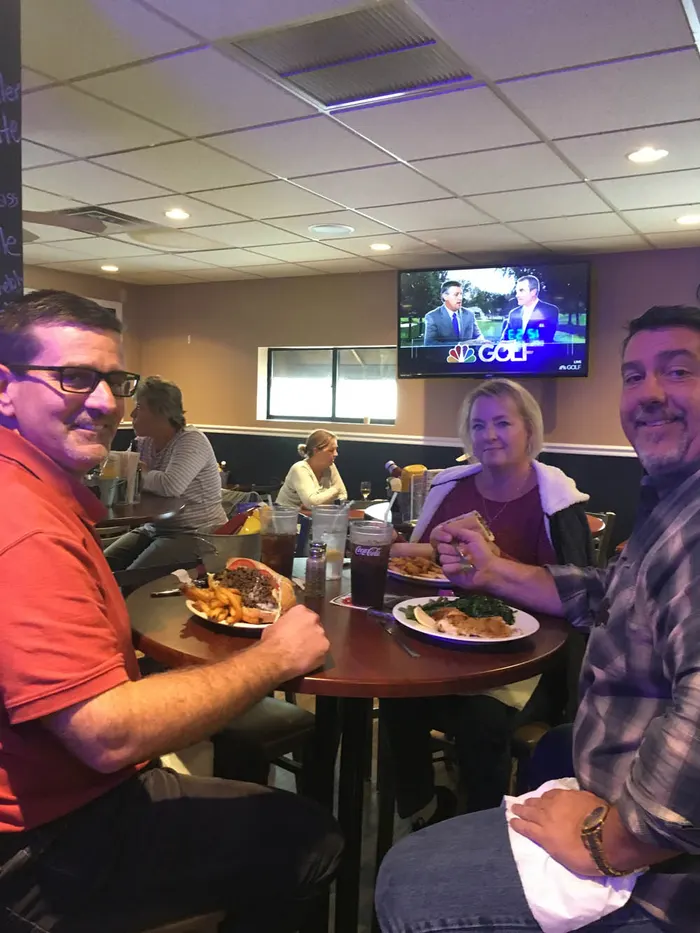 Guests and food at 1048 Bar & Grill